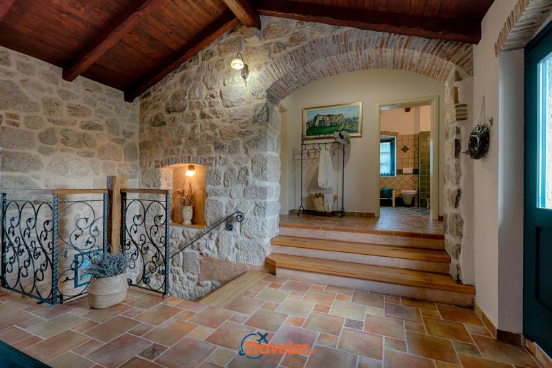 Holiday villa with pool in Croatia, rustically decorated hallway with a jacket hanger