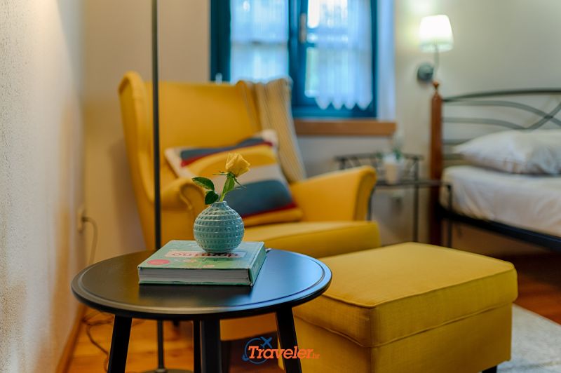 Holiday villa with pool in Croatia, yellow armchair