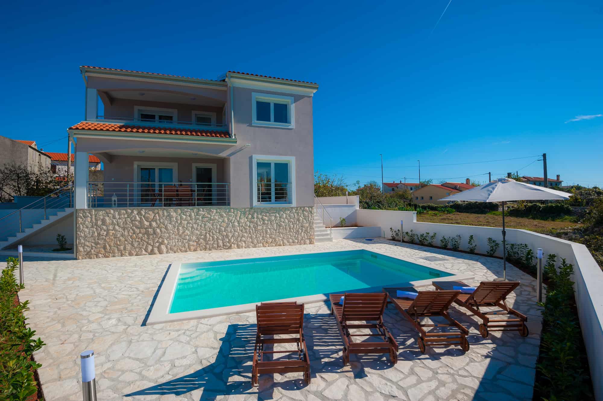 Villa with pool and sea view, in a small village
