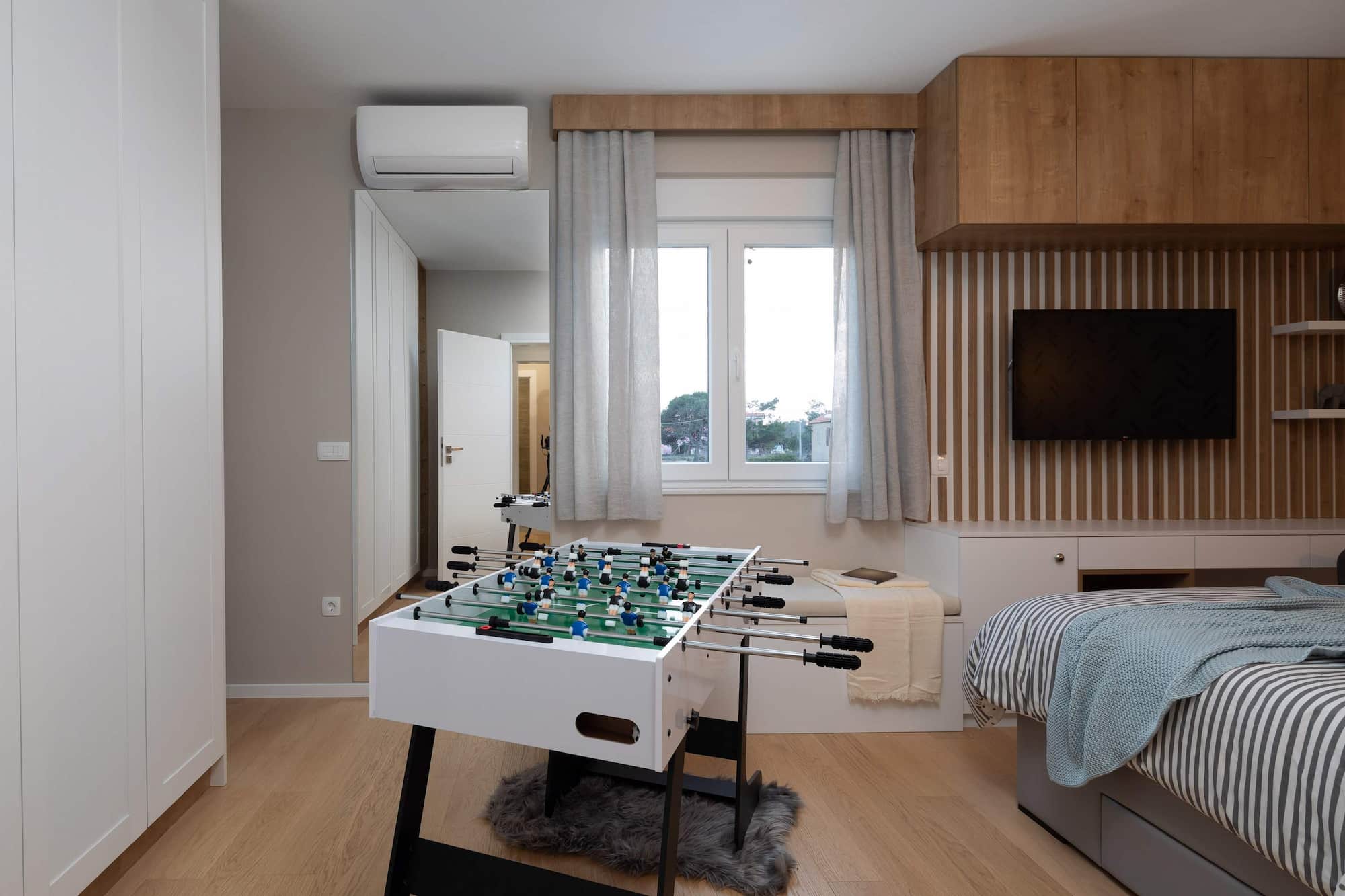 Holiday villa with pool in Croatia, table football in the bedroom