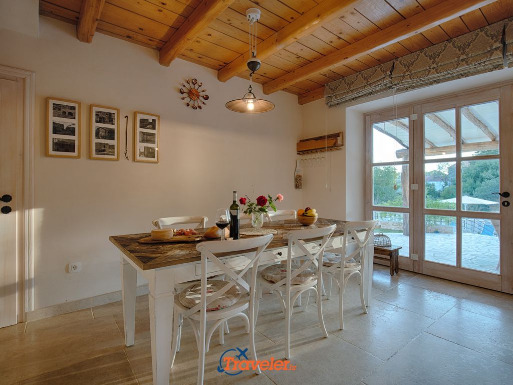 Holiday villa with pool in Croatia, dining table with chairs and table decorations