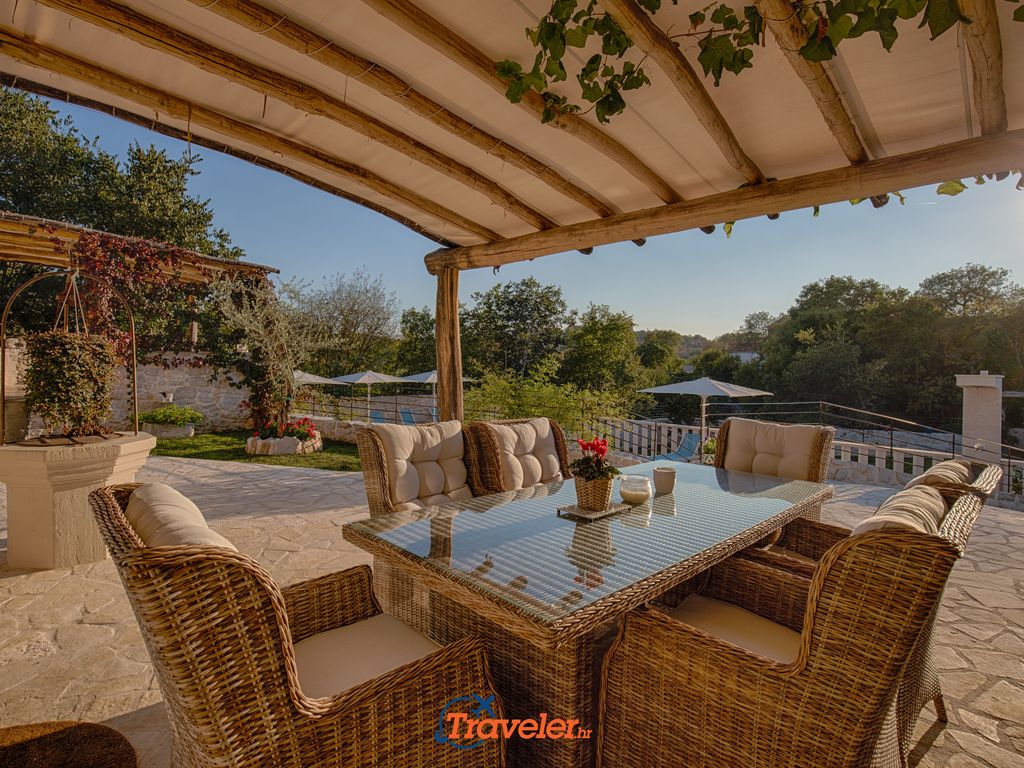 Holiday villa with pool in Croatia, dining table with chairs
